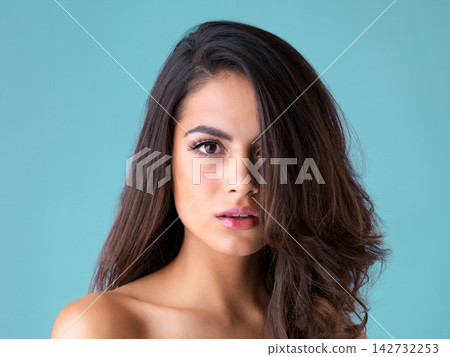Hair care, cosmetics and portrait of woman in studio for beauty, keratin treatment or natural glow on blue background. Salon, aesthetic and model with hairstyle for confident, satisfaction or shampoo Hair care, cosmetics and portrait of woman in studio for beauty, keratin treatment or natural glow on blue background. Salon, aesthetic and model with hairstyle for confident, satisfaction or shampoo 142732253