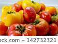 Large overripe red and yellow tomatoes 142732321