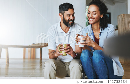 Couple, home and coffee for relax on floor, calm and morning smile in living room. Love, house and laugh for man and female person in step, together and support or unity with tea or drink in lounge 142732384