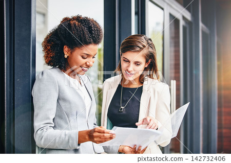 Business, women and discussion in office with folder for teamwork, collaboration and growth as accountant. Employees, happy or smile with financial reviews, records and auditing for company account Business, women and discussion in office with folder for teamwork, collaboration and growth as accountant. Employees, happy or smile with financial reviews, records and auditing for company account 142732406