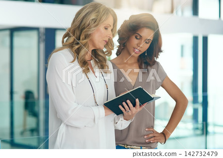 Business women, planning and tablet with learning and discussion for intern with company advice. Computer, website process and communication in a office with tech and digital editor training for job Business women, planning and tablet with learning and discussion for intern with company advice. Computer, website process and communication in a office with tech and digital editor training for job 142732479