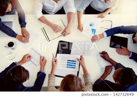 Above, documents and business with people in meeting for strategy planning, teamwork and collaboration for analytics sales. Corporate, finance and group with support, digital or data statistics Above, documents and business with people in meeting for strategy planning, teamwork and collaboration for analytics sales. Corporate, finance and group with support, digital or data statistics 142732649