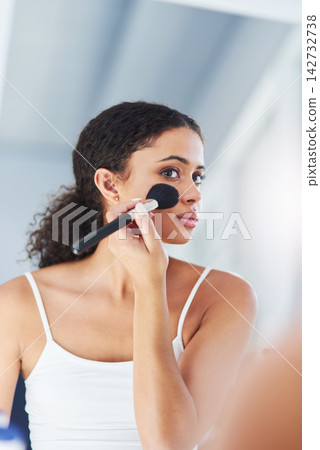 Makeup brush, mirror and black woman with beauty in bathroom for cosmetics, makeover or foundation. Lens Flare, hand and person with tools for contour powder, glowing skin or morning routine in home Makeup brush, mirror and black woman with beauty in bathroom for cosmetics, makeover or foundation. Lens Flare, hand and person with tools for contour powder, glowing skin or morning routine in home 142732738