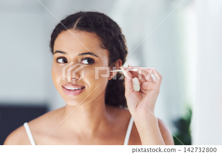 Home, woman and cotton bud for ears, hygiene and cleaning with wellness, grooming routine and bathroom. Person, apartment and girl with beauty product, healthy and cosmetics items with self care 142732800