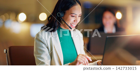 Happy woman, call center and communication with laptop at night in office for customer service and CRM advice. Chat, virtual assistant and questions for support, contact and telemarketing help 142733015