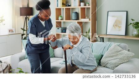Senior, woman and caregiver with help or walking stick for mobility, injury healing and retirement support in nursing home. Elderly person, nurse and helpful with movement or medical care in homecare Senior, woman and caregiver with help or walking stick for mobility, injury healing and retirement support in nursing home. Elderly person, nurse and helpful with movement or medical care in homecare 142733136