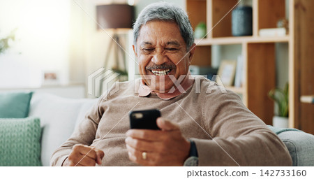 Senior, happy man and winning with phone for online bingo, prize or lottery in financial freedom or retirement at home. Excited male person with smile for mobile smartphone, celebration or good news Senior, happy man and winning with phone for online bingo, prize or lottery in financial freedom or retirement at home. Excited male person with smile for mobile smartphone, celebration or good news 142733160