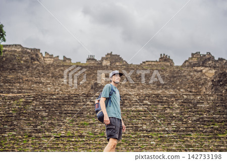Man traveler exploring ancient stone structures at Tonina Maya ruins in Chiapas Mexico with pre Hispanic history stone walls cultural heritage Mexican archaeology and exploring the ancient ruins. Man traveler exploring ancient stone structures at Tonina Maya ruins in Chiapas Mexico with pre Hispanic history stone walls cultural heritage Mexican archaeology and exploring the ancient ruins. 142733198