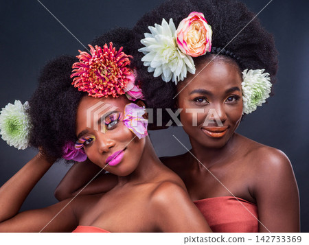 Black woman, portrait and afro hair care in studio with flower nature for organic beauty, makeup or eco friendly. Female people, friends and face on grey background for cosmetics, creative or plants Black woman, portrait and afro hair care in studio with flower nature for organic beauty, makeup or eco friendly. Female people, friends and face on grey background for cosmetics, creative or plants 142733369