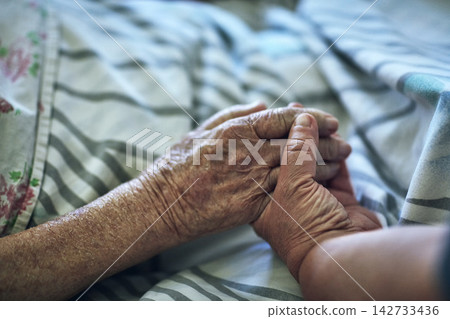 Senior person, hands and visit with hospital, closeup and pensioner care or love together. Elderly people, couple and relationship for medical checkup, help or empathy for surgery recovery and health Senior person, hands and visit with hospital, closeup and pensioner care or love together. Elderly people, couple and relationship for medical checkup, help or empathy for surgery recovery and health 142733436