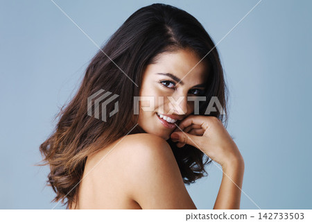 Portrait, skincare and beauty of happy woman for hair care, health or wellness isolated on blue studio background. Face, hairstyle and model in makeup cosmetics at hairdresser salon for glow or shine Portrait, skincare and beauty of happy woman for hair care, health or wellness isolated on blue studio background. Face, hairstyle and model in makeup cosmetics at hairdresser salon for glow or shine 142733503