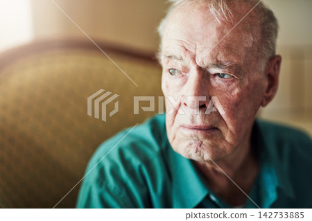 Senior, man and sad with thinking of grief in retirement home with remember, nostalgia and memory on sofa. Elderly, person and lonely with alzheimers, depression and thoughtful on couch with mockup 142733885