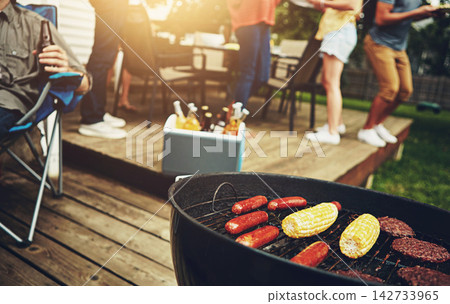 Friends, drinks and bbq with food for dinner, party or reunion with alcohol in America. People, grill and meat for meal at barbecue in backyard, summer and vacation at party, celebration or birthday Friends, drinks and bbq with food for dinner, party or reunion with alcohol in America. People, grill and meat for meal at barbecue in backyard, summer and vacation at party, celebration or birthday 142733965