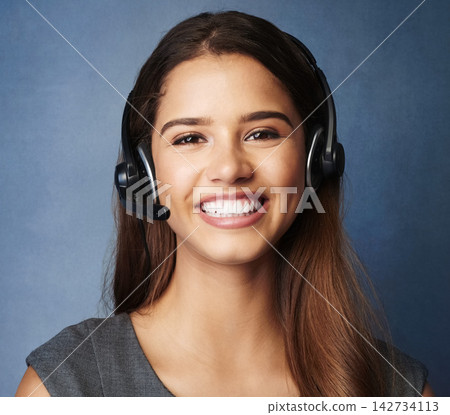 Girl, smile and studio portrait for call center work, telemarketing career and virtual assistant for outbound sales company. Woman, blue background and faq for contact us, communication and support. Girl, smile and studio portrait for call center work, telemarketing career and virtual assistant for outbound sales company. Woman, blue background and faq for contact us, communication and support. 142734113