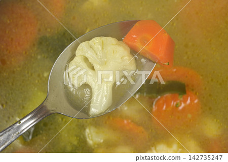 Cauliflower and Carrot on Metal Spoon 142735247