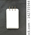 Blank White Ring Notebook on Dark Textured Background 142735944