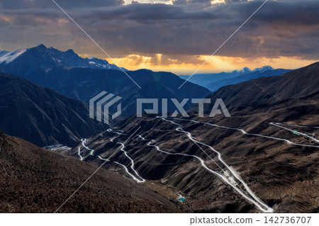 Winding Mountain Road Through Tibetan Plateau at Sunset Winding Mountain Road Through Tibetan Plateau at Sunset 142736707