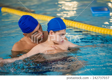 Child with cerebral palsy doing aquatic therapy Child with cerebral palsy doing aquatic therapy 142737037