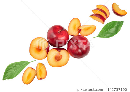 fresh red plum and half with leaves isolated on white background. Top view. Flat lay fresh red plum and half with leaves isolated on white background. Top view. Flat lay 142737190