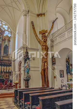 Nitra, Slovakia - May 23, 2024: Monumental Figure of Jesus Christ in a Catholic Church Interior Nitra, Slovakia - May 23, 2024: Monumental Figure of Jesus Christ in a Catholic Church Interior 142737700