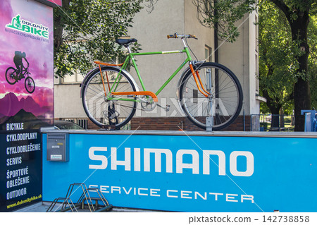 Nitra, Slovakia - May 27, 2024: Display Bicycle Above Dolomity Bike Storefront Nitra, Slovakia - May 27, 2024: Display Bicycle Above Dolomity Bike Storefront 142738858