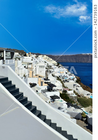 Santorini, Greece, Iconic White Buildings and Blue Sea View Santorini, Greece, Iconic White Buildings and Blue Sea View 142739163