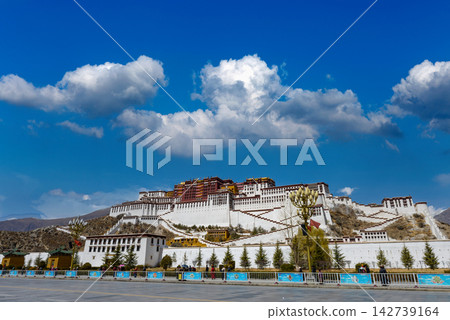 Potala Palace in Lhasa, Tibet, China, under a clear blue sky with white clouds Potala Palace in Lhasa, Tibet, China, under a clear blue sky with white clouds 142739164