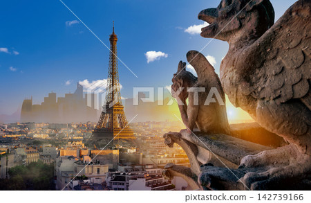 Gargoyle overlooking the Eiffel Tower and Paris skyline at sunset Gargoyle overlooking the Eiffel Tower and Paris skyline at sunset 142739166