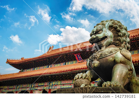 Traditional Chinese Stone Guardian Lion in Front of the Forbidden City Palace in Beijing Under Blue Sky Traditional Chinese Stone Guardian Lion in Front of the Forbidden City Palace in Beijing Under Blue Sky 142739181
