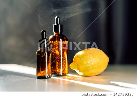 Lemon vitamin c serum bottles for natural skincare Lemon vitamin c serum bottles for natural skincare 142739383