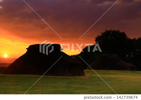 A thatched hut bathed in the morning light A thatched hut bathed in the morning light 142739674