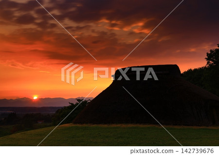 A thatched hut bathed in the morning light A thatched hut bathed in the morning light 142739676