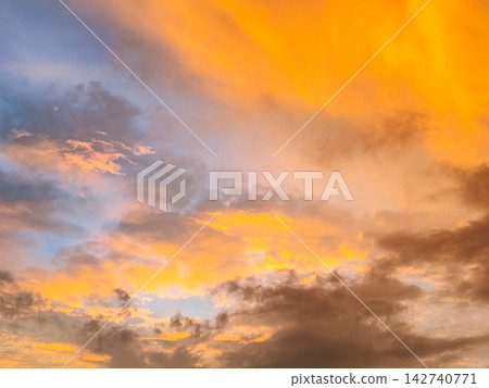 Clouds floating in the sunset sky Clouds floating in the sunset sky 142740771