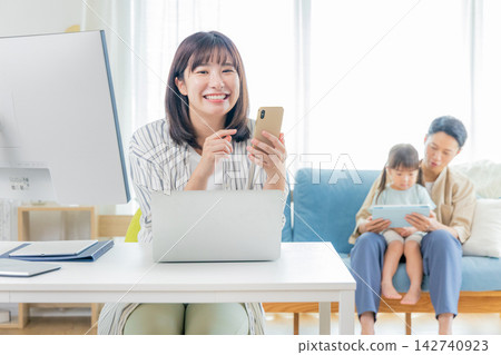 Woman doing telework Woman doing telework 142740923