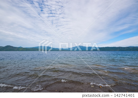 A view of Lake Tazawa and the surrounding mountains in Akita Prefecture. A view of Lake Tazawa and the surrounding mountains in Akita Prefecture. 142741401