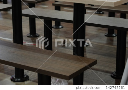 Bird in an empty cafeteria scene Bird in an empty cafeteria scene 142742261