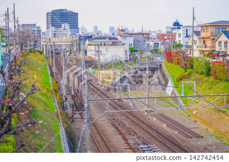 An aerial view of the multiple railway lines extending into Jiyugaoka. An aerial view of the multiple railway lines extending into Jiyugaoka. 142742454