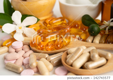 Alternative medicine herbal organic capsule with vitamin E omega 3 fish oil, mineral, drug with herbs leaf natural supplements for healthy good life. Alternative medicine herbal organic capsule with vitamin E omega 3 fish oil, mineral, drug with herbs leaf natural supplements for healthy good life. 142743577