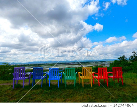 A view of the observation spot lined with colorful chairs. A view of the observation spot lined with colorful chairs. 142744064