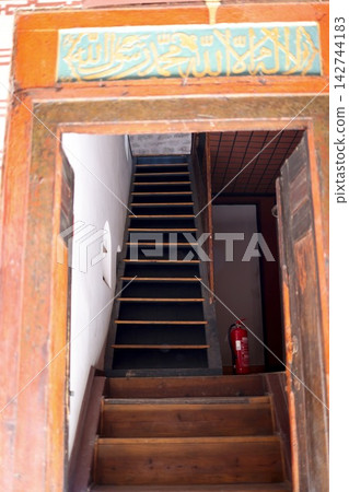 Wooden staircases and decorative doors leading to old buildings in the old city of Istanbul Wooden staircases and decorative doors leading to old buildings in the old city of Istanbul 142744183