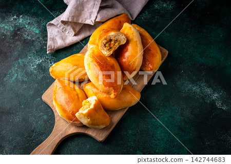 Traditional baked pies pirozhki with meat. Traditional baked pies pirozhki with meat. 142744683