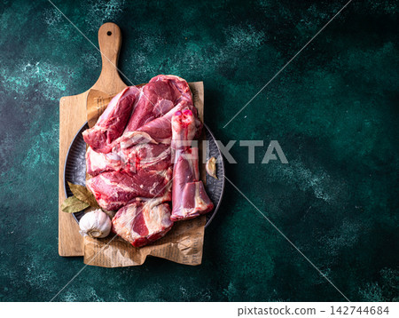 Raw leg of lamb, ready to cook Raw leg of lamb, ready to cook 142744684