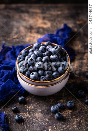 Fresh ripe blueberry berries in bowl Fresh ripe blueberry berries in bowl 142744687