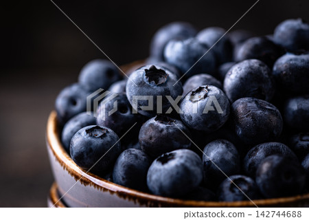 Fresh ripe blueberry berries in bowl 142744688