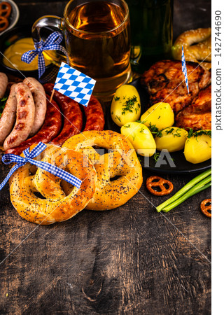 Oktoberfest food: beer, pretzel, sausages, stewed cabbage, potato Oktoberfest food: beer, pretzel, sausages, stewed cabbage, potato 142744690