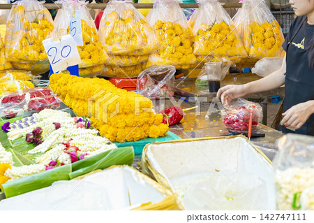 Colorful flowers and garlands sold at Bangkok's Pak Khlong Flower Market Colorful flowers and garlands sold at Bangkok's Pak Khlong Flower Market 142747111