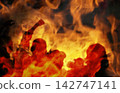 Conceptual composition with silhouettes of people protesting against a background of fierce blazing fire. Riot, revolution, and crisis concept 142747141