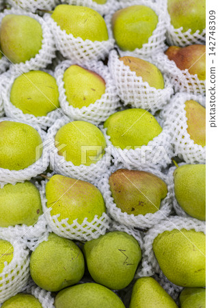 Fragrant Pears Packed In Mesh Nets Fragrant Pears Packed In Mesh Nets 142748309