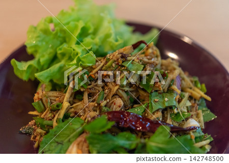 Thai Isan bamboo shoot soup salad herbs roasted rice chili fresh vegetables served crisp lettuce representing traditional northeastern Thai cuisine Thai Isan bamboo shoot soup salad herbs roasted rice chili fresh vegetables served crisp lettuce representing traditional northeastern Thai cuisine 142748500