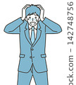 The image of an office worker who has messed up at work and is holding their head in their hands. 142748756